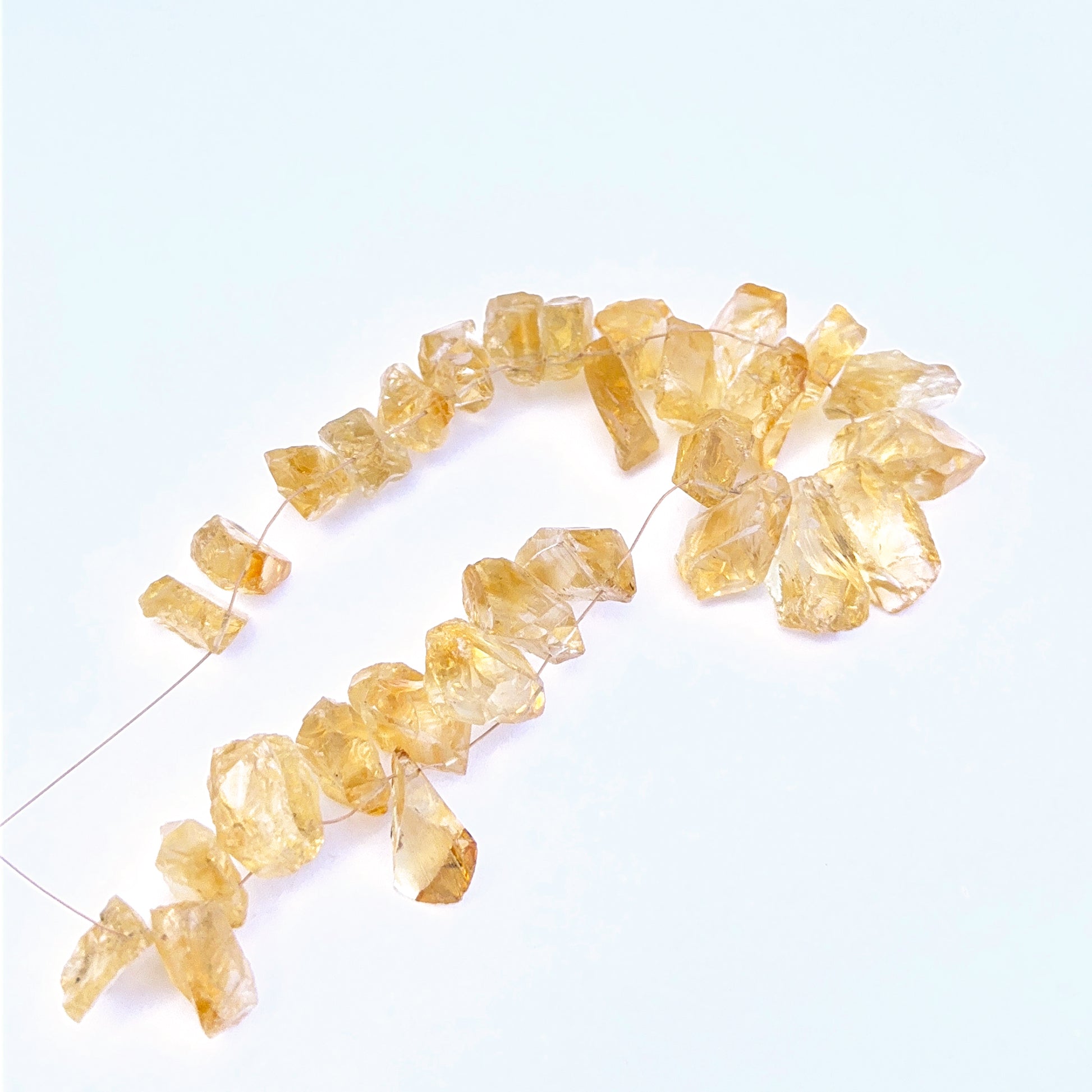 Handmade jewellery components featuring citrine rough beads in 9–12mm sizing.