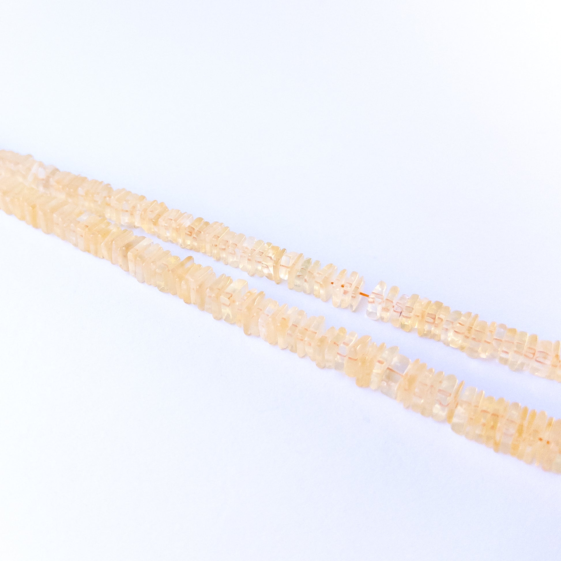 Handmade jewellery components featuring authentic Citrine square heishi beads with bright golden sparkle.