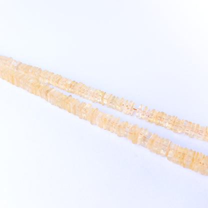 Handmade jewellery components featuring authentic Citrine square heishi beads with bright golden sparkle.