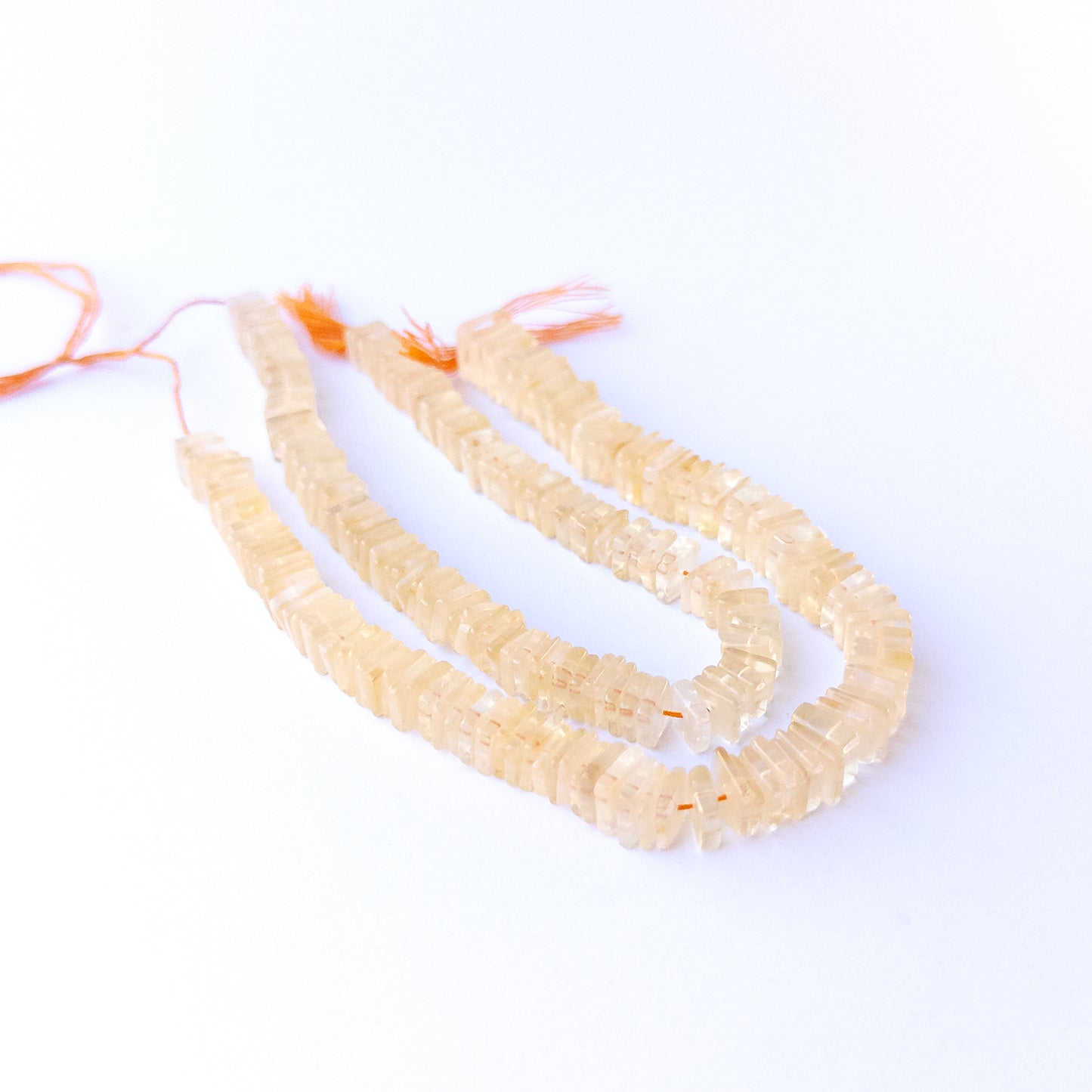 Citrine square heishi gemstone beads 6.5–9mm arranged in a warm golden 20cm strand for handmade jewellery.