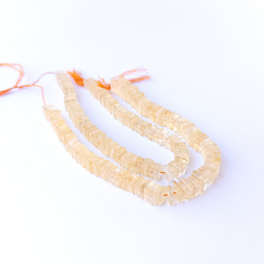 Citrine square heishi gemstone beads 6.5–9mm arranged in a warm golden 20cm strand for handmade jewellery.