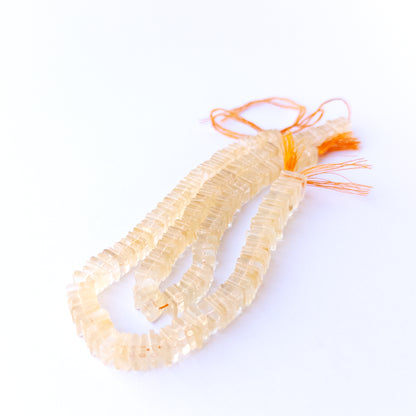 Close‑up of genuine Citrine square heishi beads highlighting their shine, clarity and carved geometric texture.