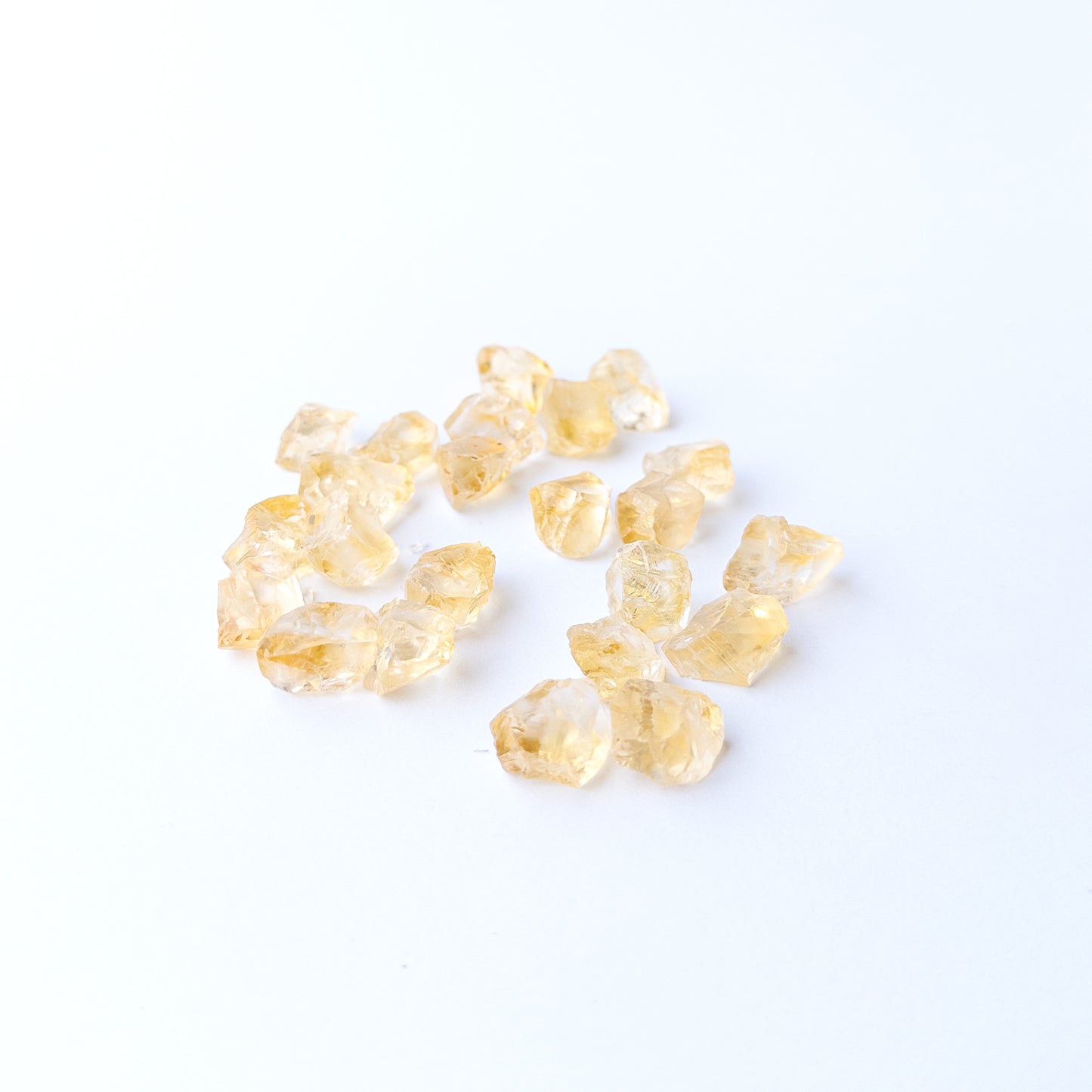 Authentic Citrine rough stones showcasing bright yellow tones and raw crystalline surfaces.