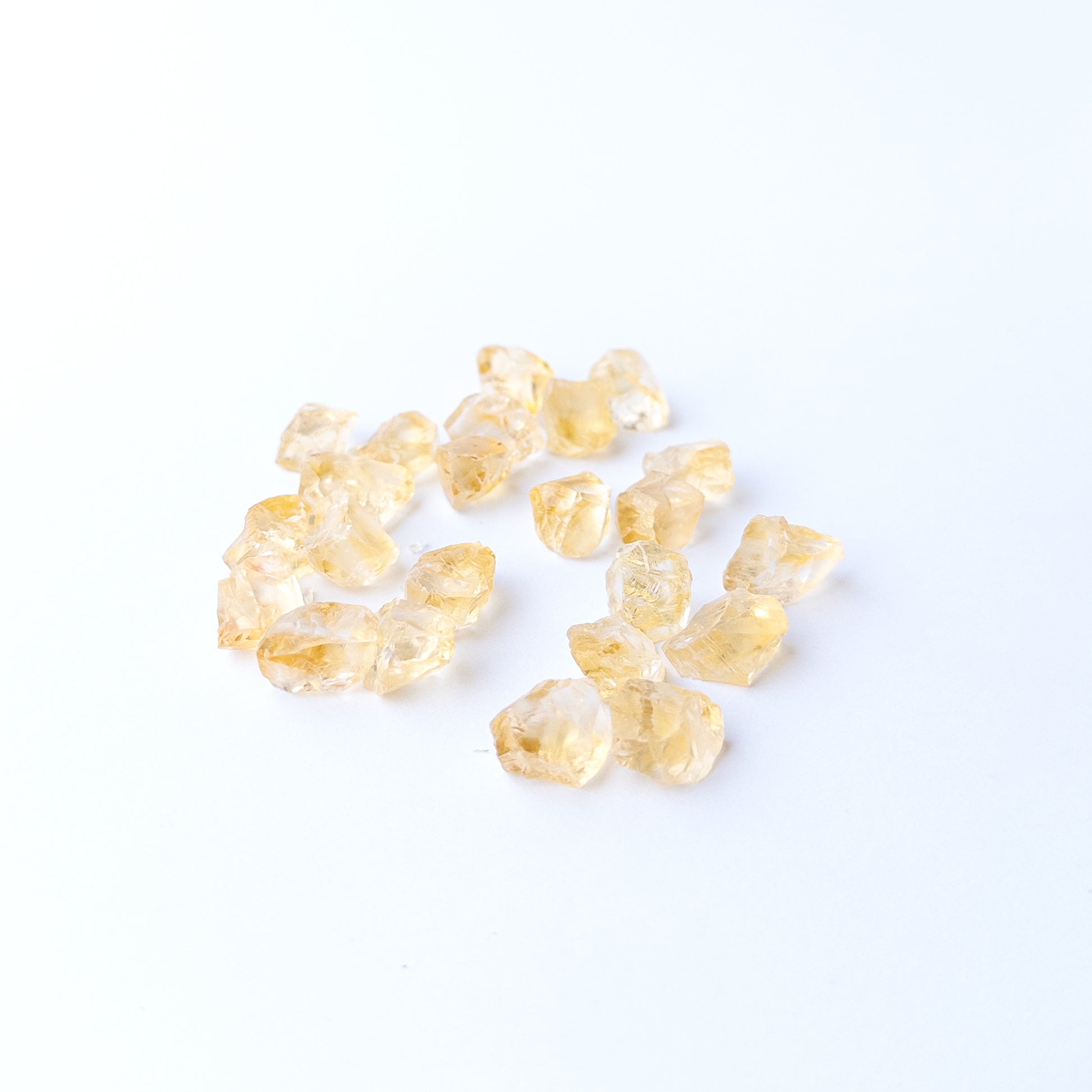Authentic Citrine rough stones showcasing bright yellow tones and raw crystalline surfaces.
