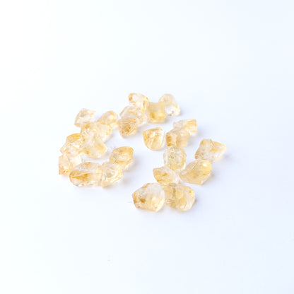 Authentic Citrine rough stones showcasing bright yellow tones and raw crystalline surfaces.