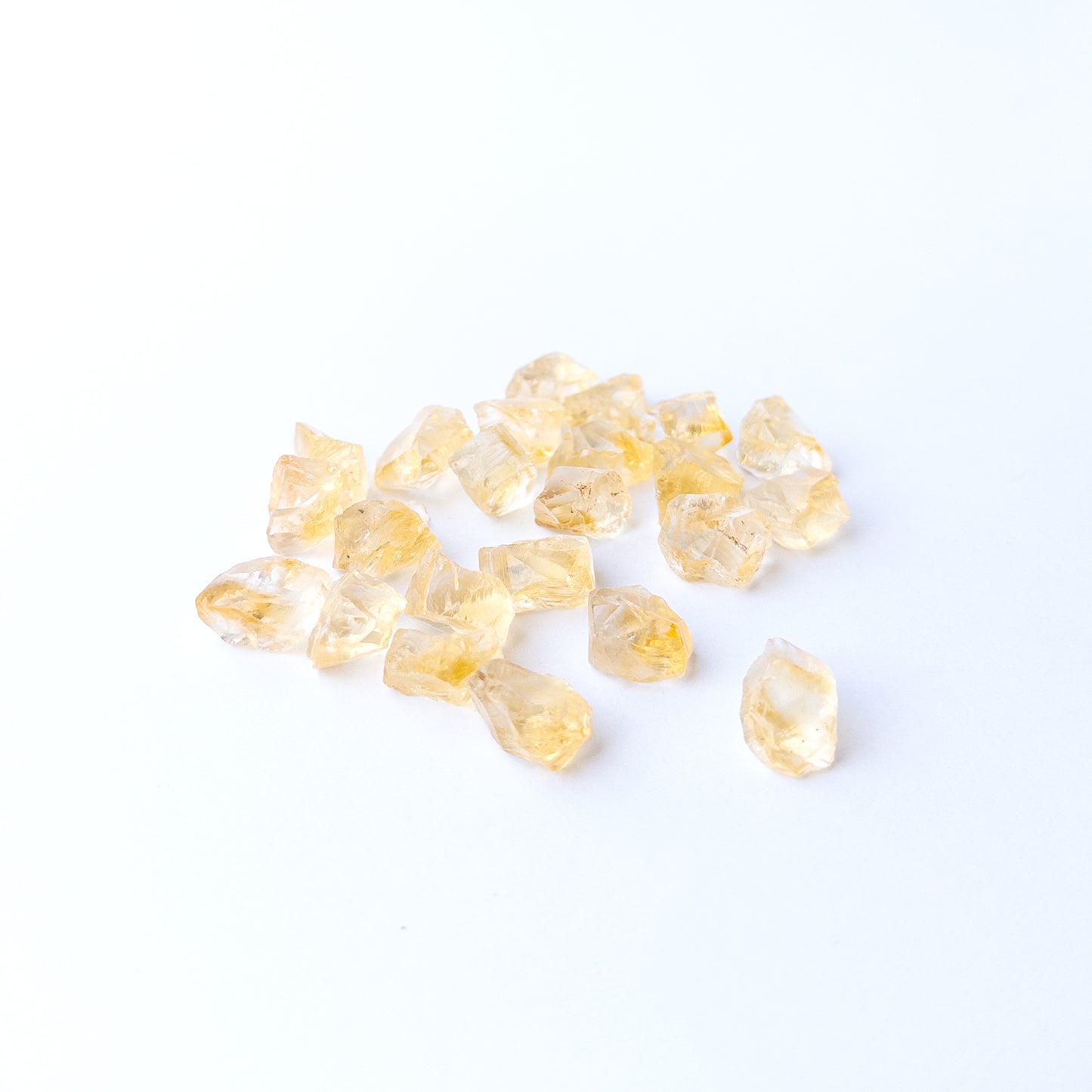 Premium Citrine rough gemstone pieces arranged together with natural sparkle and organic shapes.