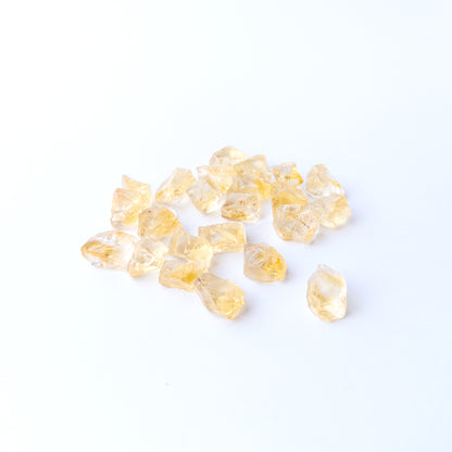 Premium Citrine rough gemstone pieces arranged together with natural sparkle and organic shapes.