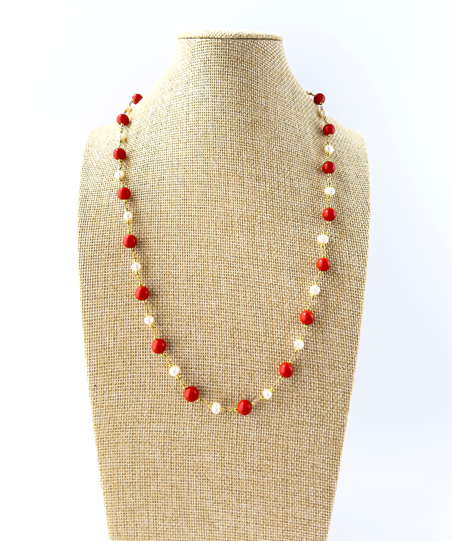 Coral and Freshwater Pearls necklace featuring smooth round 8mm beads arranged in a 60cm strand with a polished, elegant finish.