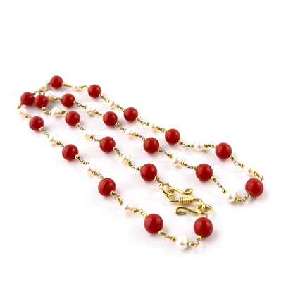 Close‑up of Coral and Freshwater Pearl smooth round beads highlighting their polished surface and harmonious colour pairing.