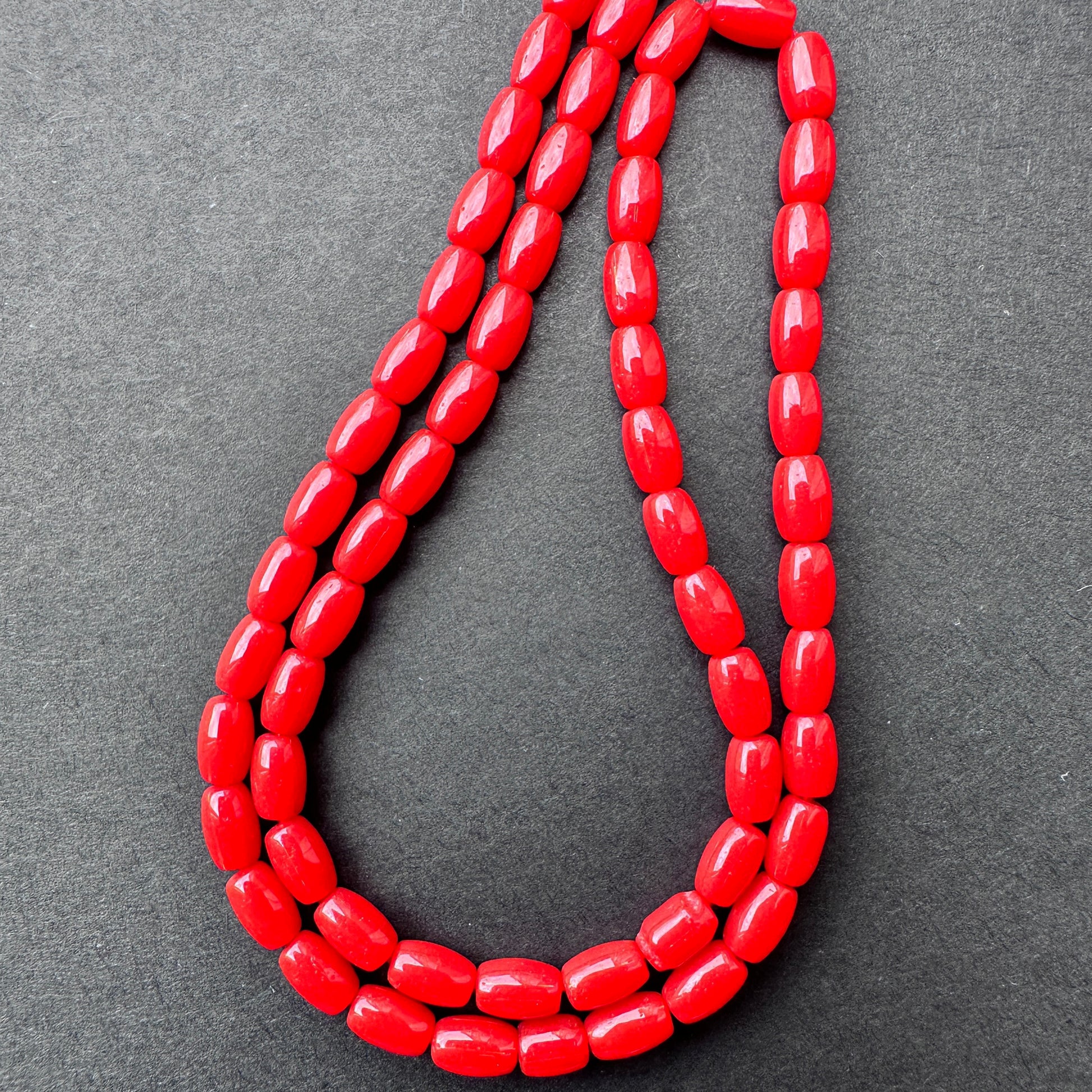 Natural gemstone beads in Coral, 5.5mm length ‚àö√≥ 3.5mm breadth, ideal for vibrant DIY jewellery designs.