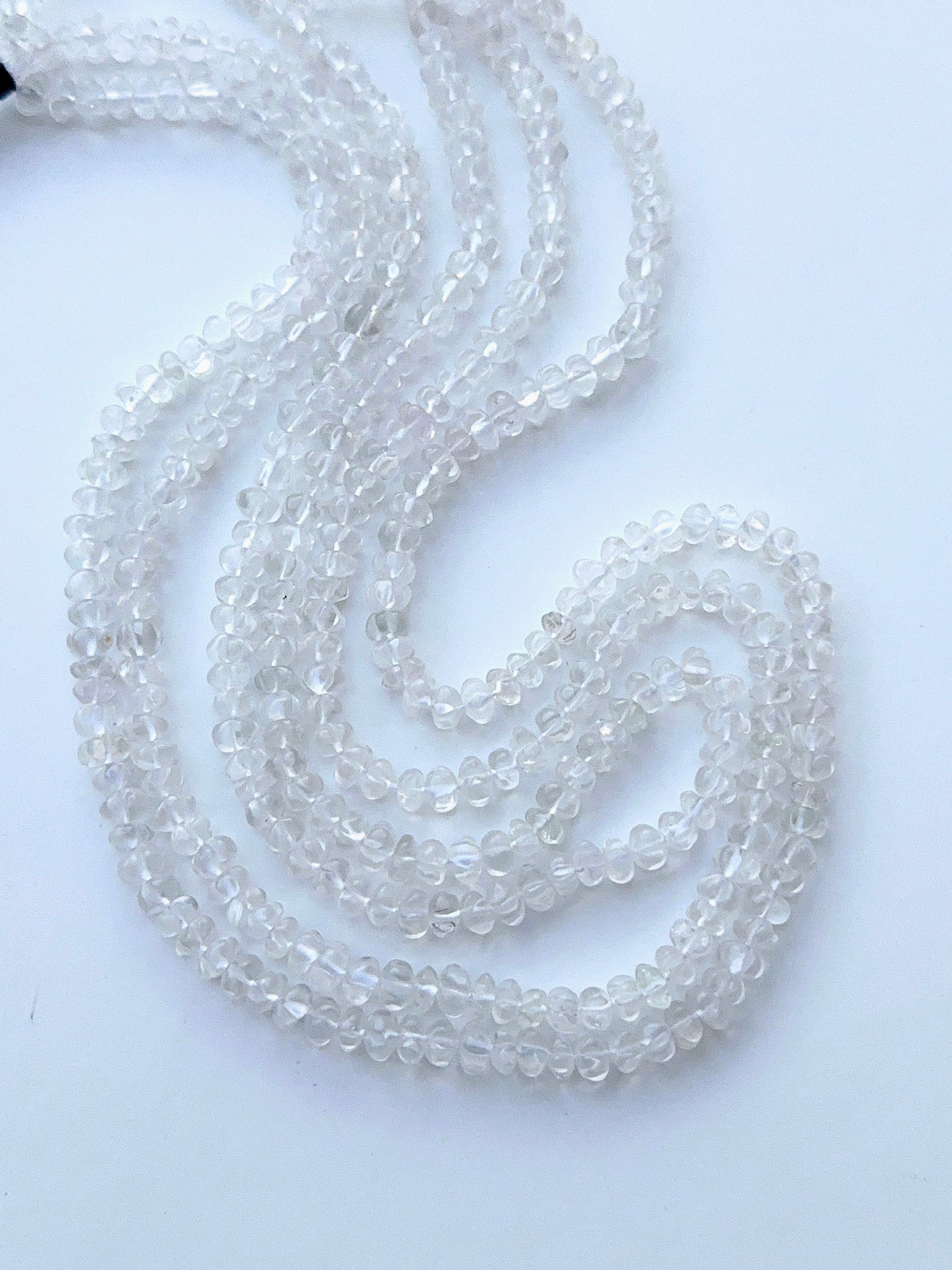 Crystal curved pumpkin beads showing bright sparkle and clear shine for handmade jewellery designs.