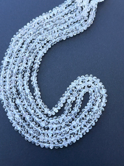 Crystal gemstone pumpkin arranged neatly to showcase clarity and precision faceting.