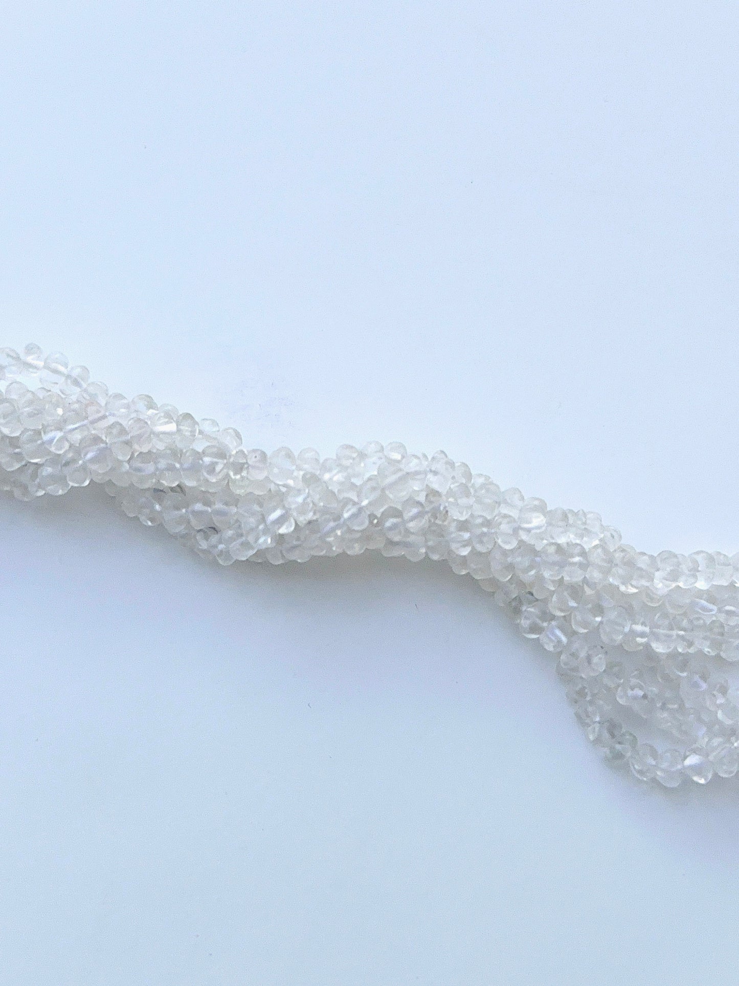 Faceted crystal beads displayed with shimmering surfaces ideal for natural gemstone jewellery making.