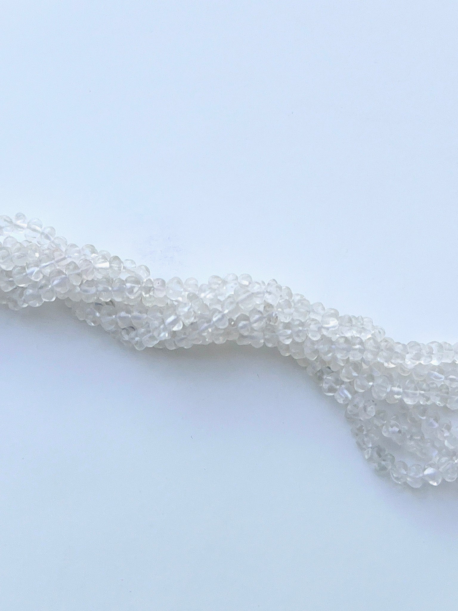 Faceted crystal beads displayed with shimmering surfaces ideal for natural gemstone jewellery making.