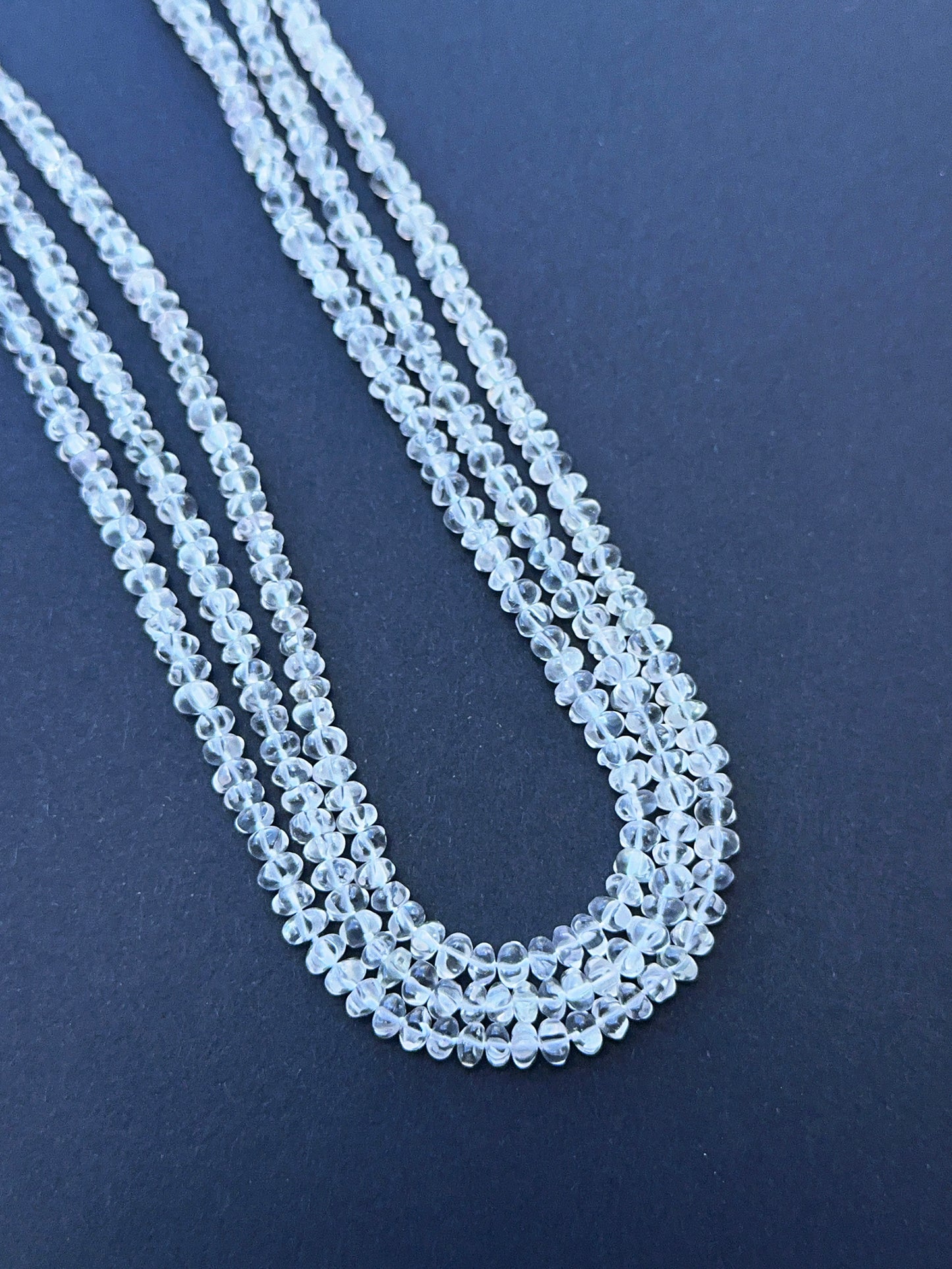 Crystal curved pumpkin photographed to show their brilliance and suitability for handmade jewellery.