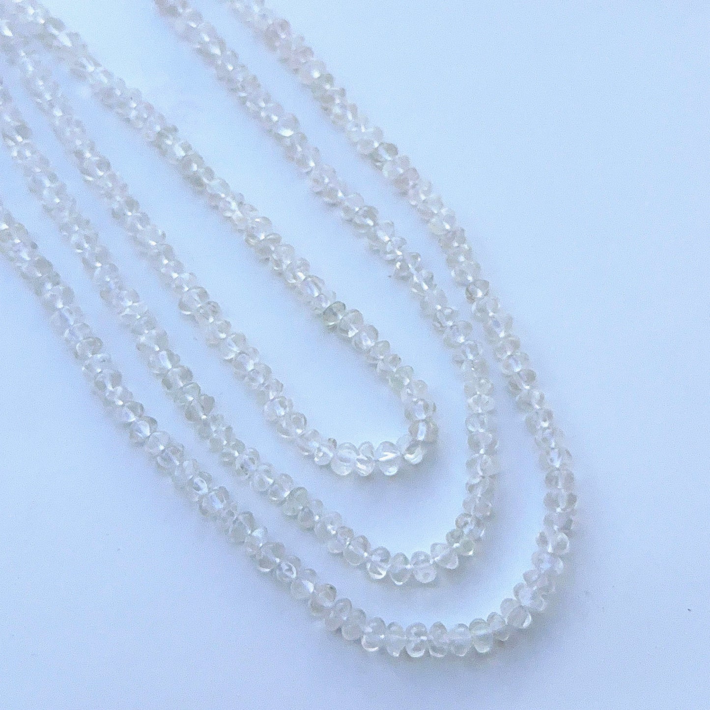 Close‑up of crystal curved pumpkin highlighting their polished cut and reflective surfaces.