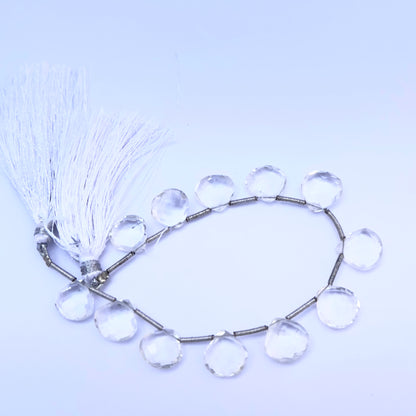 Close-up of Crystal heart briolette beads showing their clarity, cut, and reflective sparkle.