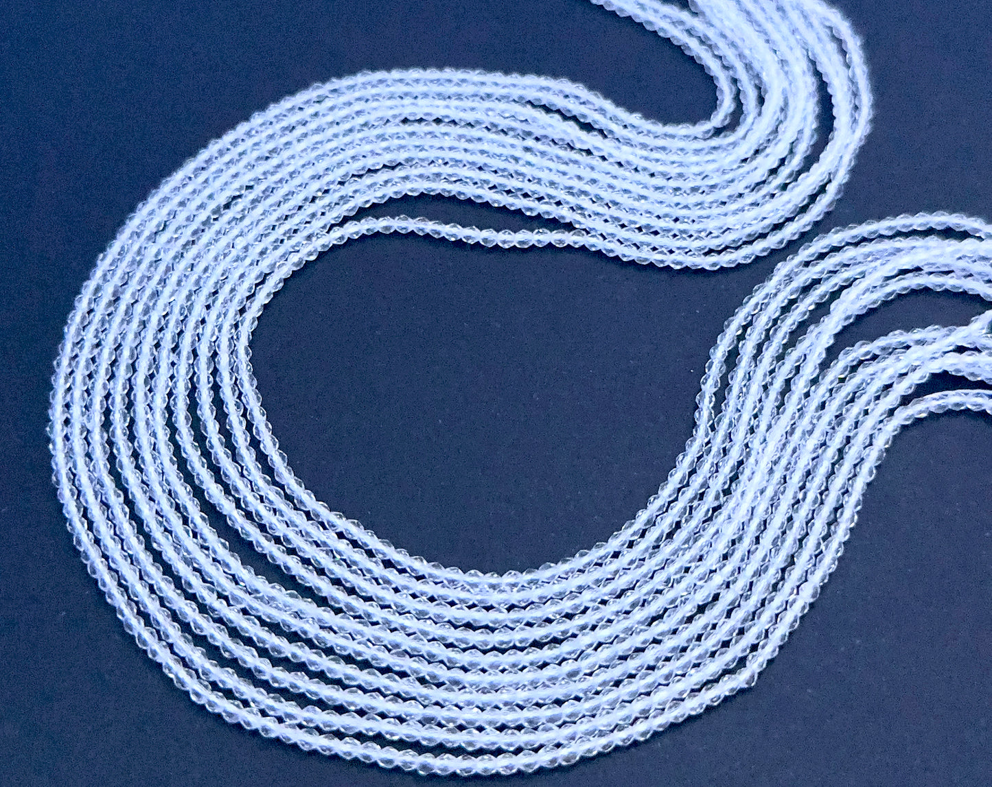 Close-up of Crystal rondelle beads showing their fine cut and polished clarity.