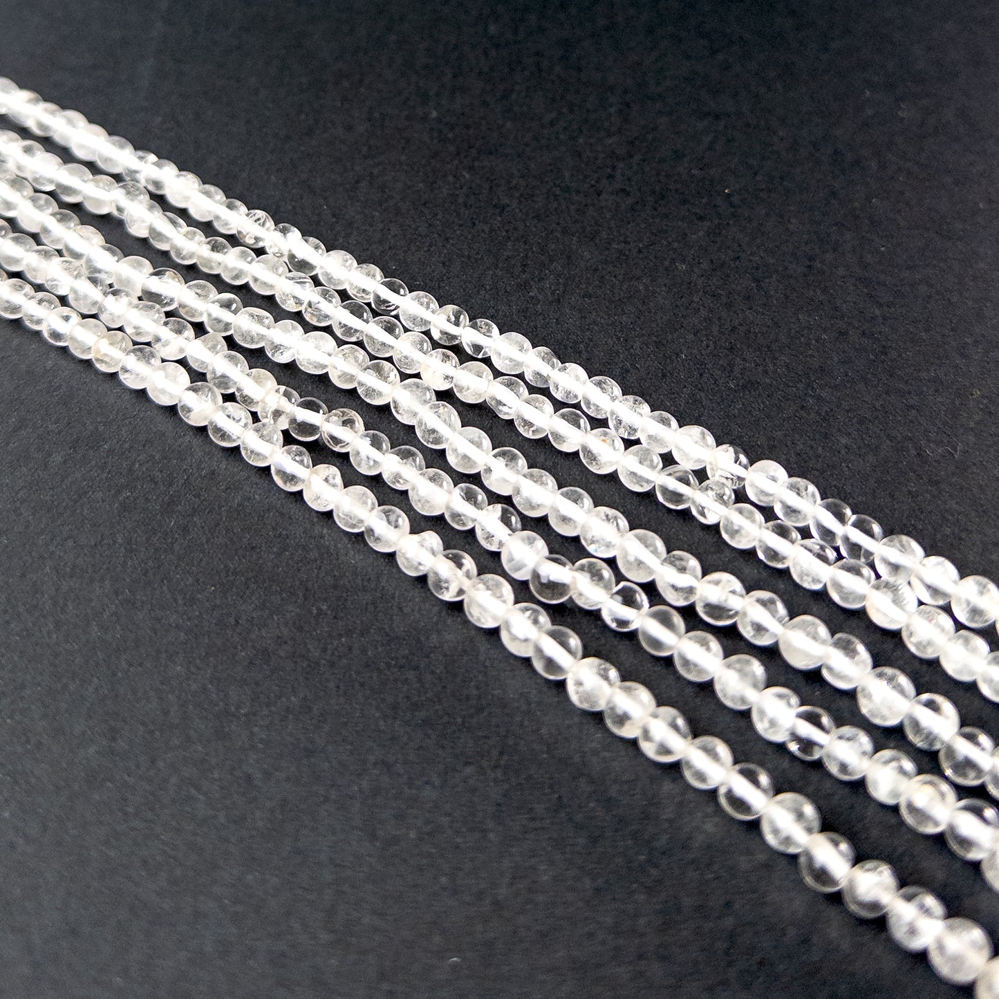 Authentic crystal gemstone beads showcasing smooth round cuts ideal for handmade jewellery components.