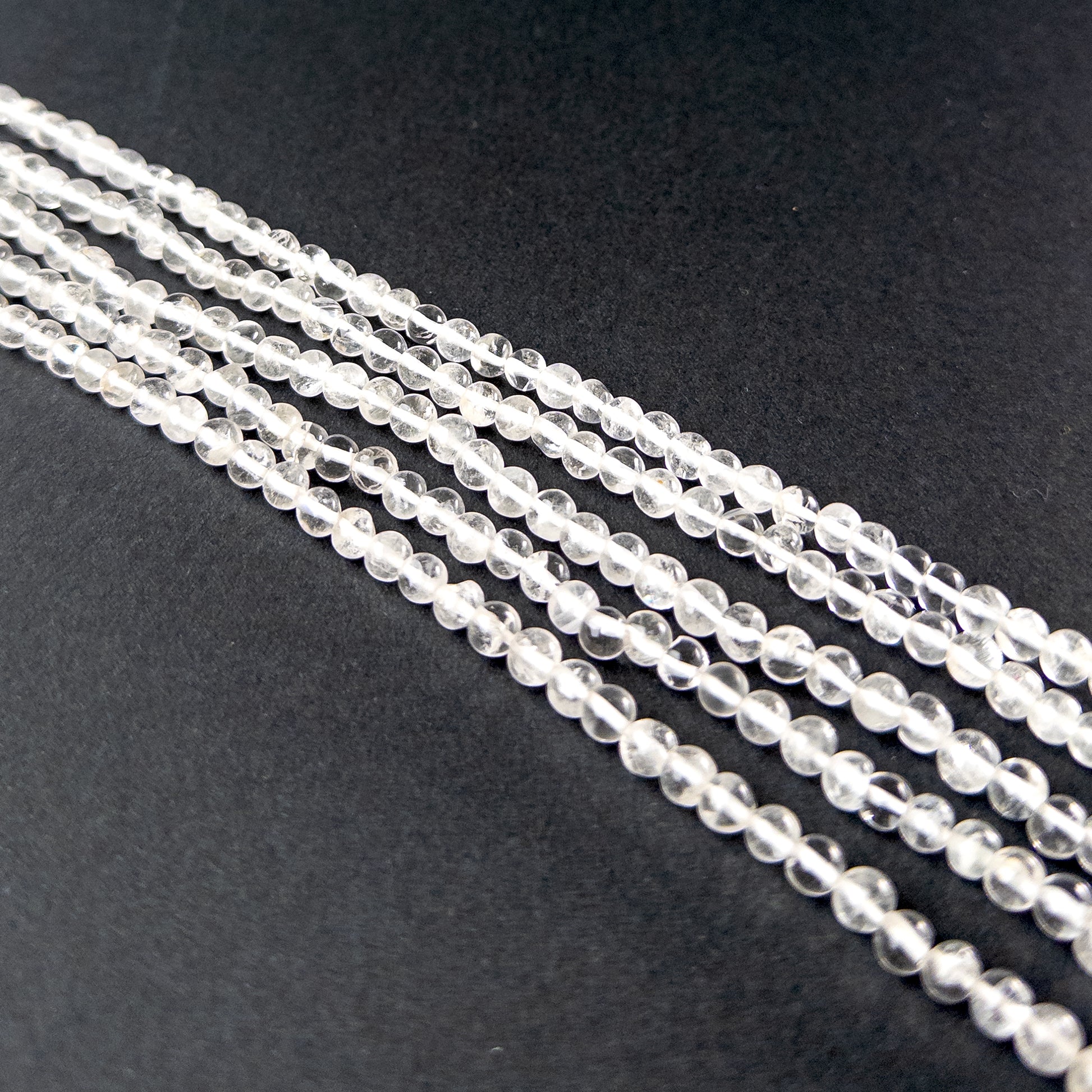 Authentic crystal gemstone beads showcasing smooth round cuts ideal for handmade jewellery components.