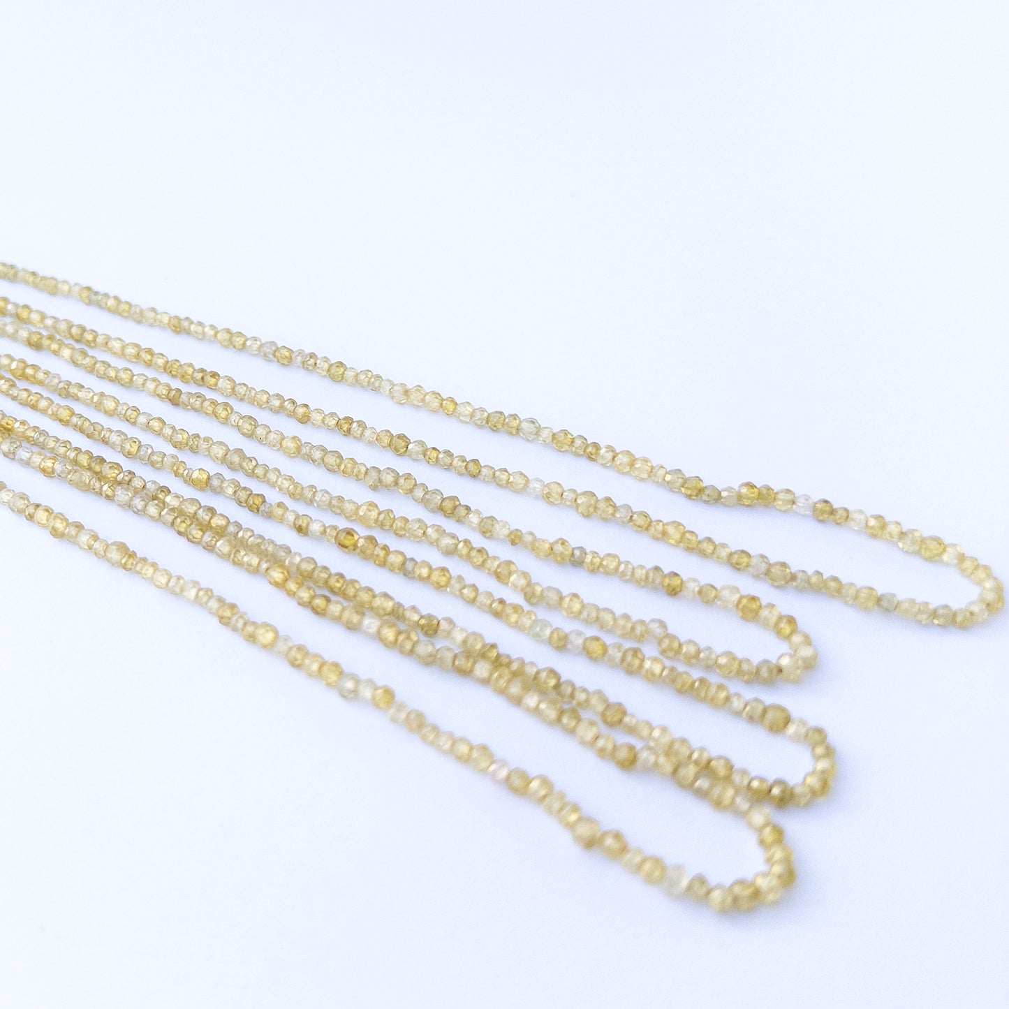 High‑quality Cubic Zirconia beads with polished faceted rondelle shapes, ideal for artisan jewellery designs.