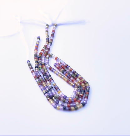 Faceted rondelle Cubic Zirconia beads in 3.1mm size strung on a 32cm strand.