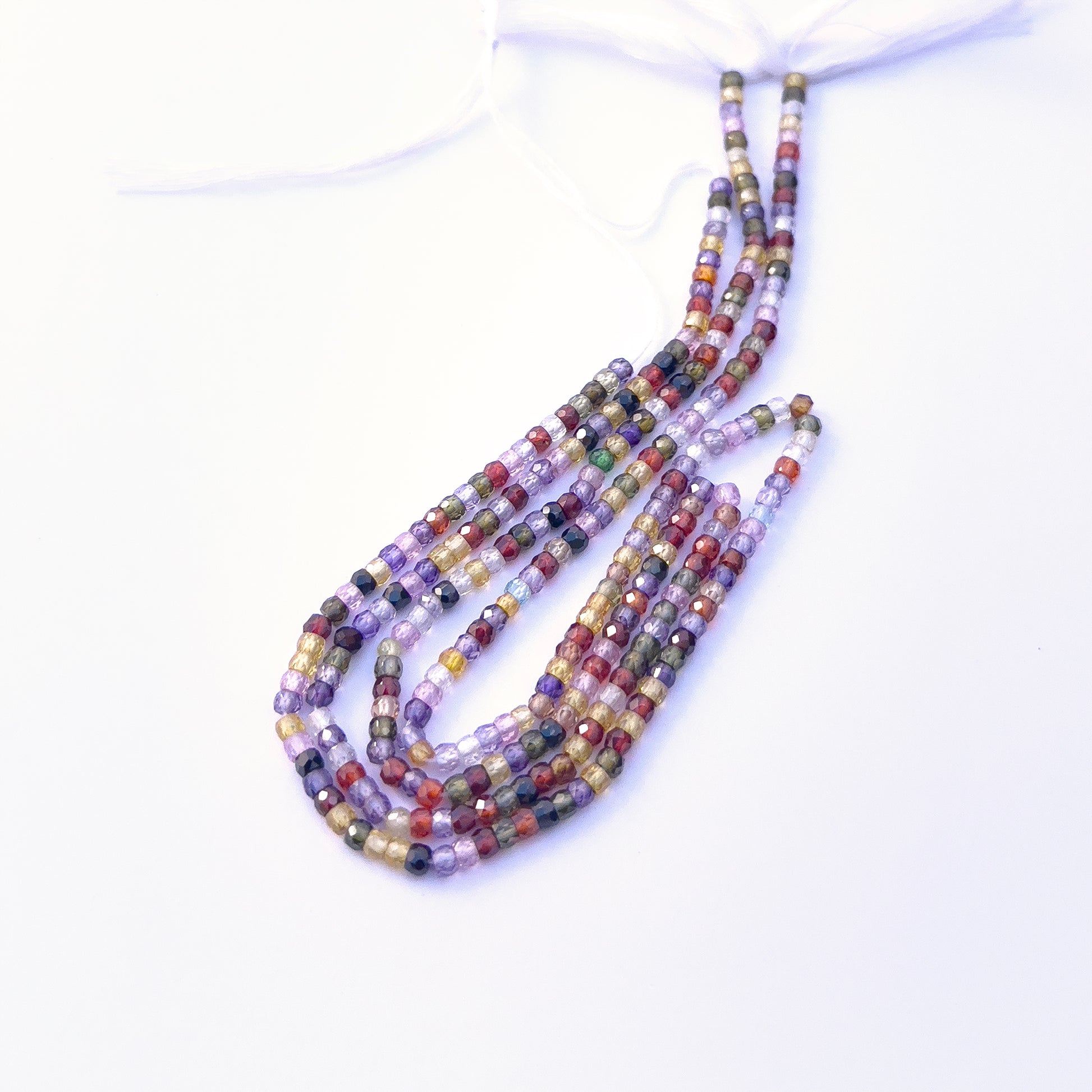 Cubic Zirconia beads with high clarity and shine, perfect for elegant jewellery designs. Detailed view of 3.1mm faceted rondelle Cubic Zirconia beads on a 32cm strand.