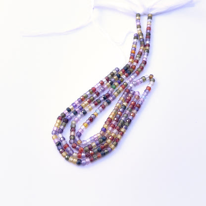 Cubic Zirconia beads with high clarity and shine, perfect for elegant jewellery designs. Detailed view of 3.1mm faceted rondelle Cubic Zirconia beads on a 32cm strand.