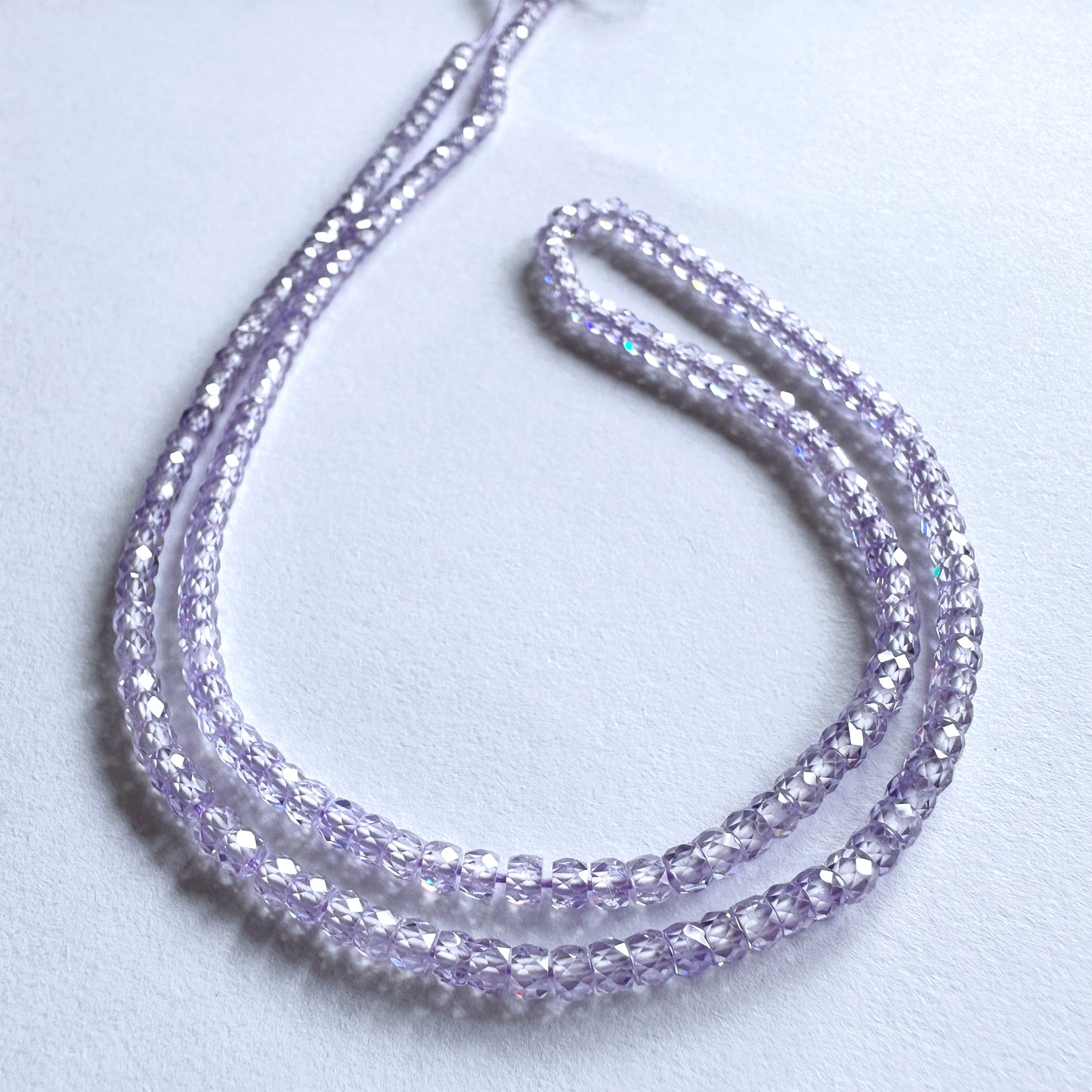 Cubic Zirconia faceted rondelle beads in 3mm size with high clarity and sparkle on a 41cm strand.