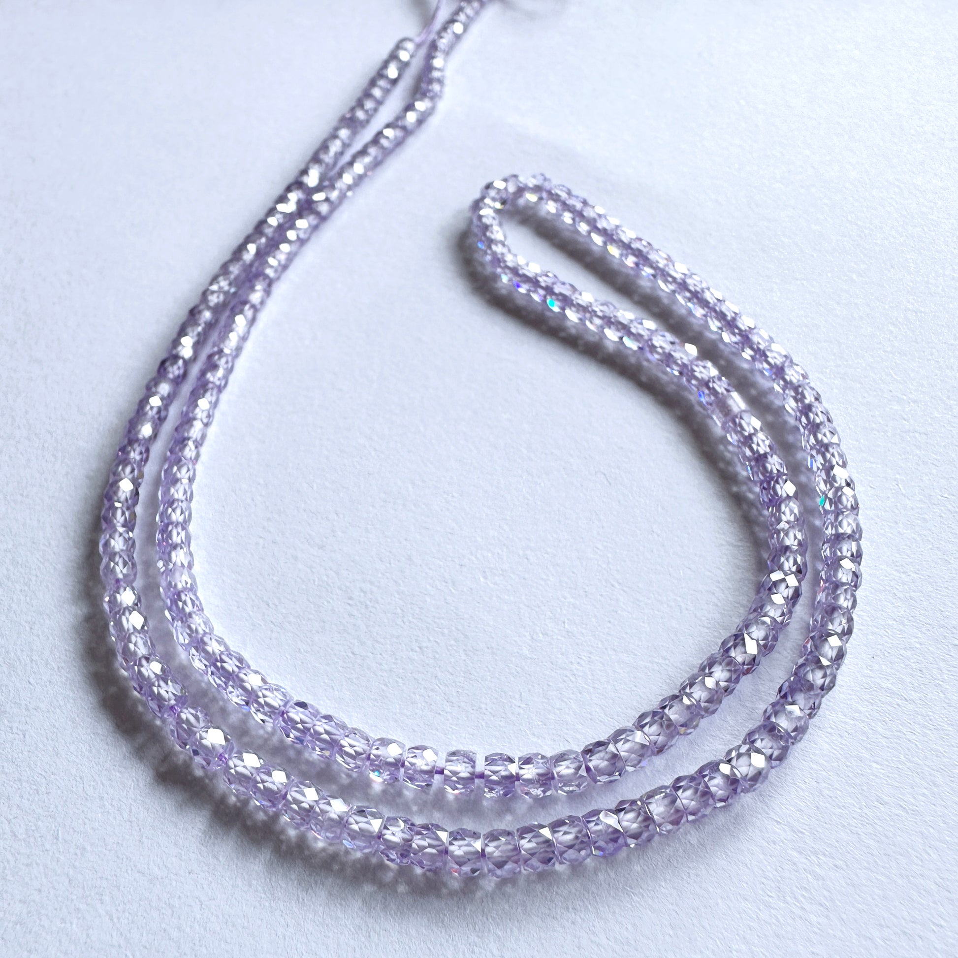 Cubic Zirconia faceted rondelle beads in 3mm size with high clarity and sparkle on a 41cm strand.