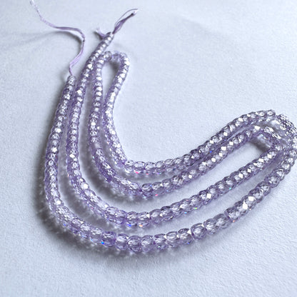 A dial gauge measures the Cubic Zirconia faceted rondelle 3mm gemstone.