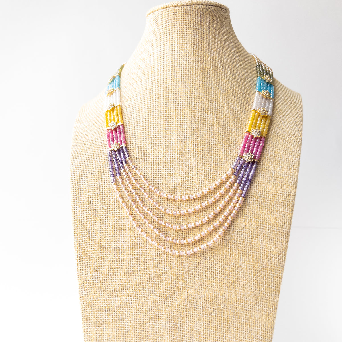 Genuine Cubic Zirconia necklace accented with lustrous Shell Pearls, creating a refined and timeless statement piece.