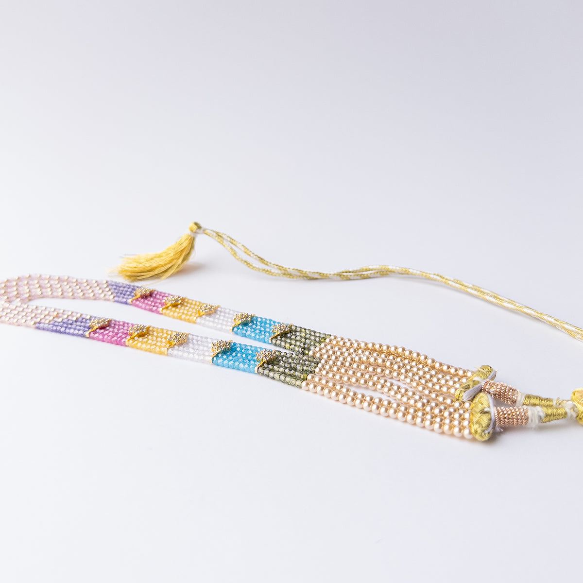 Handmade jewellery featuring faceted rondelle Cubic Zirconia beads paired with radiant Shell Pearls for classic glamour.