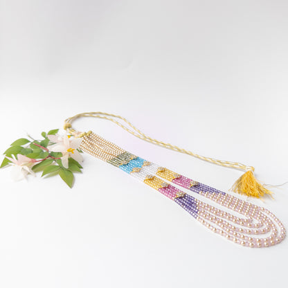 Cubic Zirconia and Shell Pearl necklace featuring five elegant strands of faceted rondelle beads with shimmering brilliance and luxurious appeal.