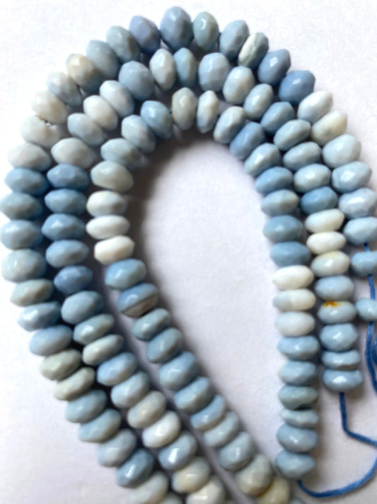 Denim Blue Opal faceted rondelle beads shimmer with a rich blue hue along a neatly strung 16cm strand.