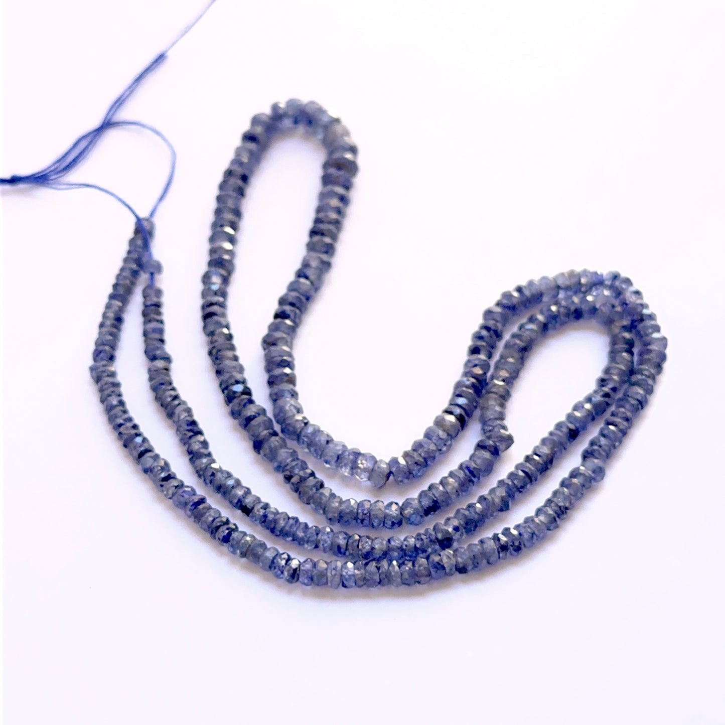Blue Sapphire 3–4mm faceted rondelle beads on a 43cm strand, perfect for bespoke designs and special‑occasion pieces.
