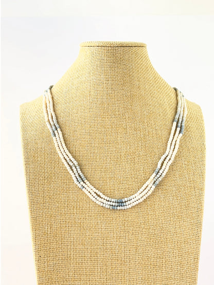 Three‑strand denim opal necklace featuring faceted rondelle beads sized 3–3.4mm in layered lengths.