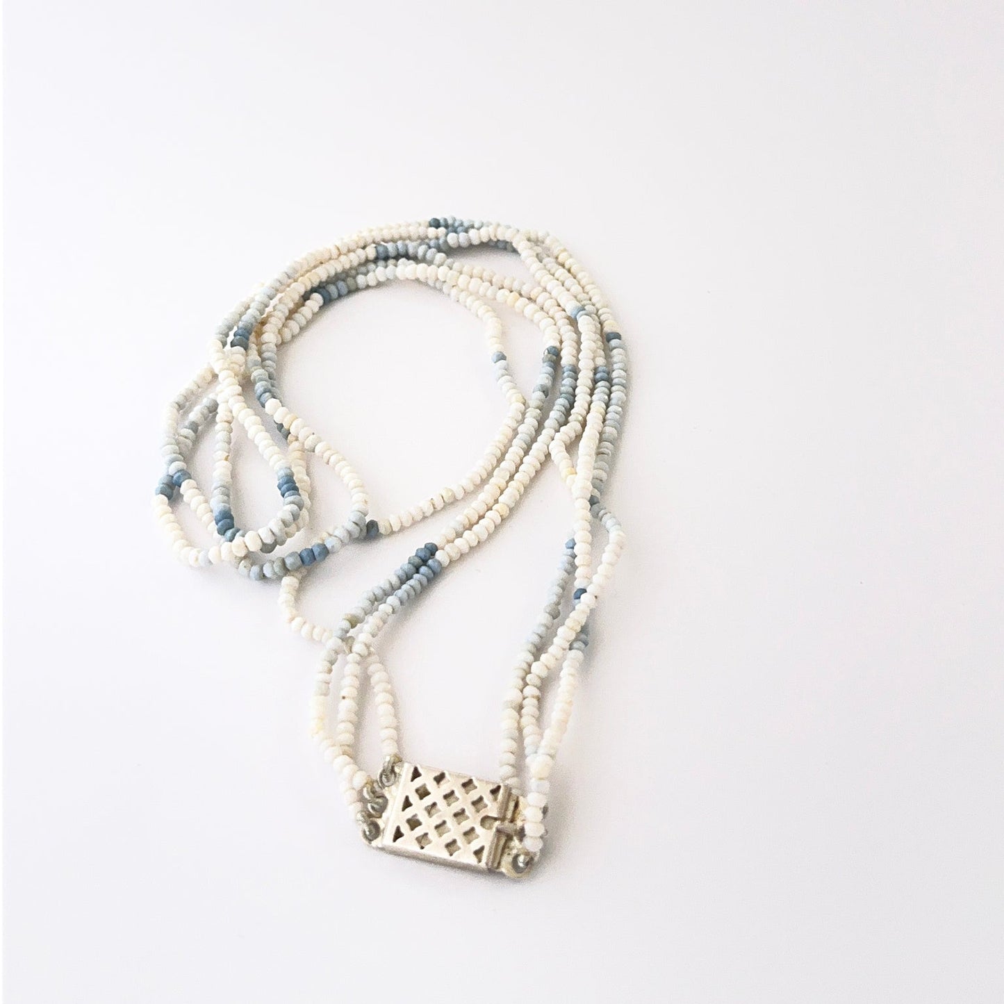 Elegant triple‑strand denim opal necklace showcasing faceted rondelle 3–3.4mm beads.