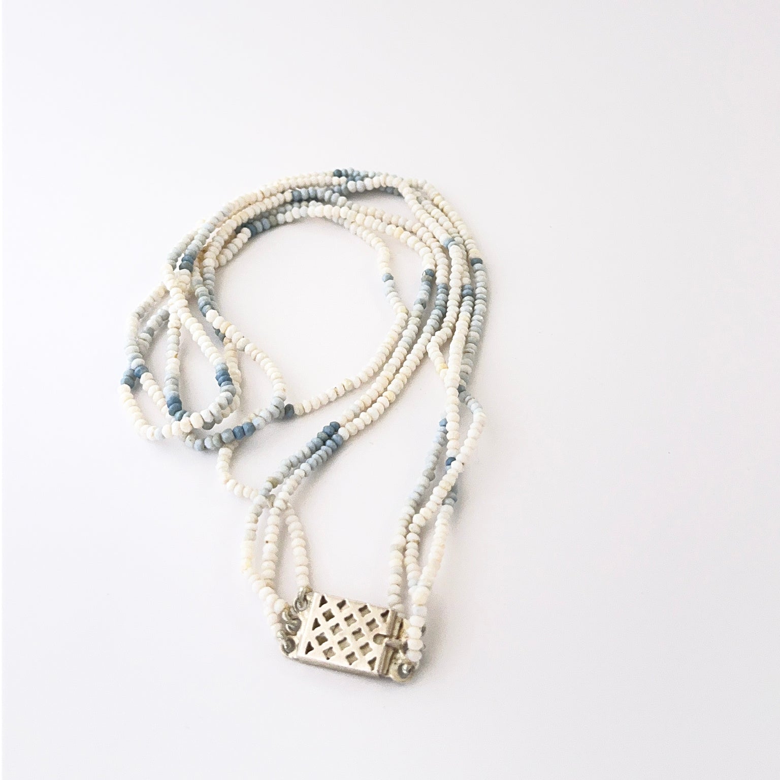 Elegant triple‑strand denim opal necklace showcasing faceted rondelle 3–3.4mm beads.