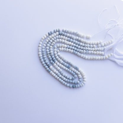 Denim Opal faceted rondelle beads in 4.6–4.7mm, showing soft denim‑blue tones for handmade jewellery components.