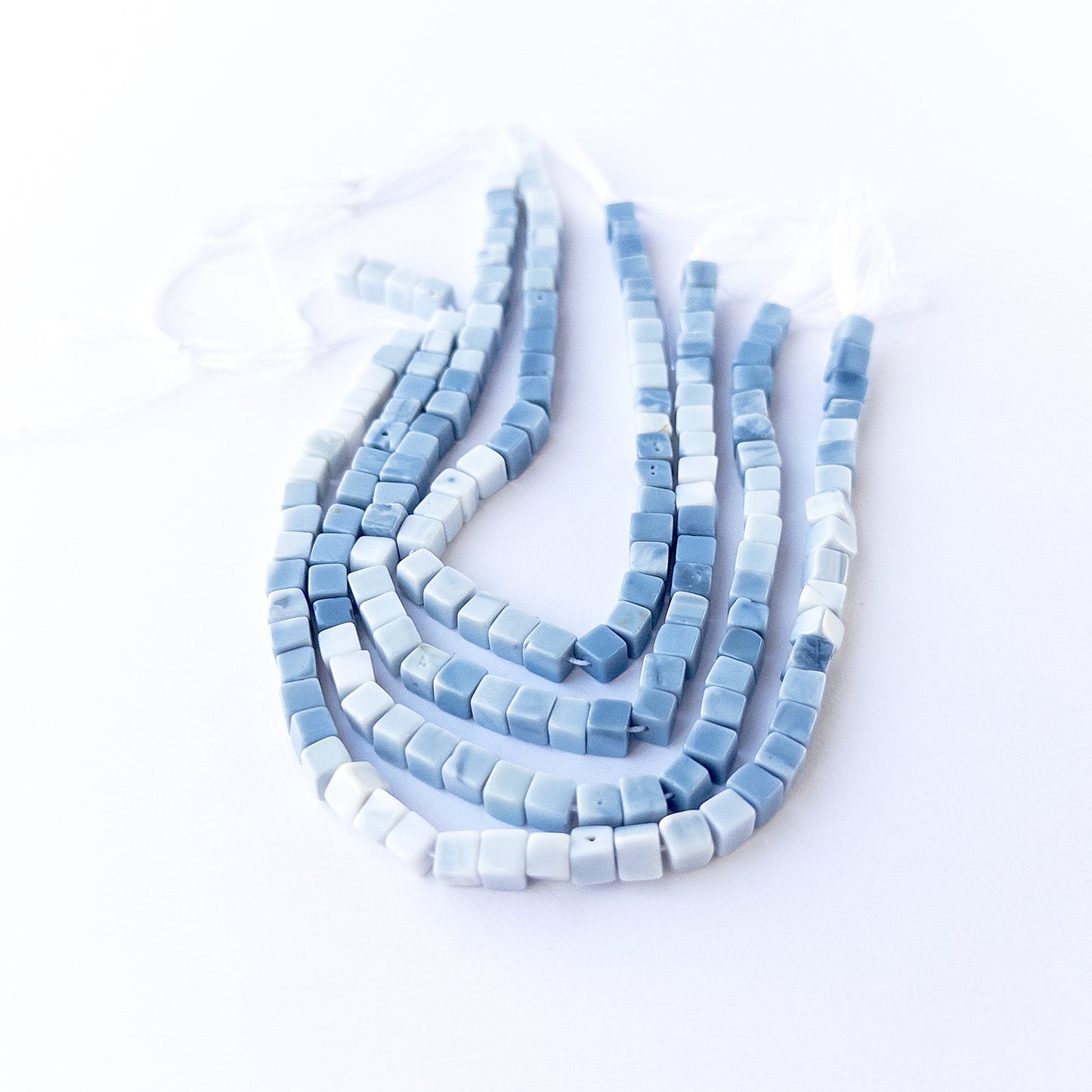 Genuine Denim Opal smooth cube stone beads with polished surfaces ideal for gemstone beads for DIY jewellery making.