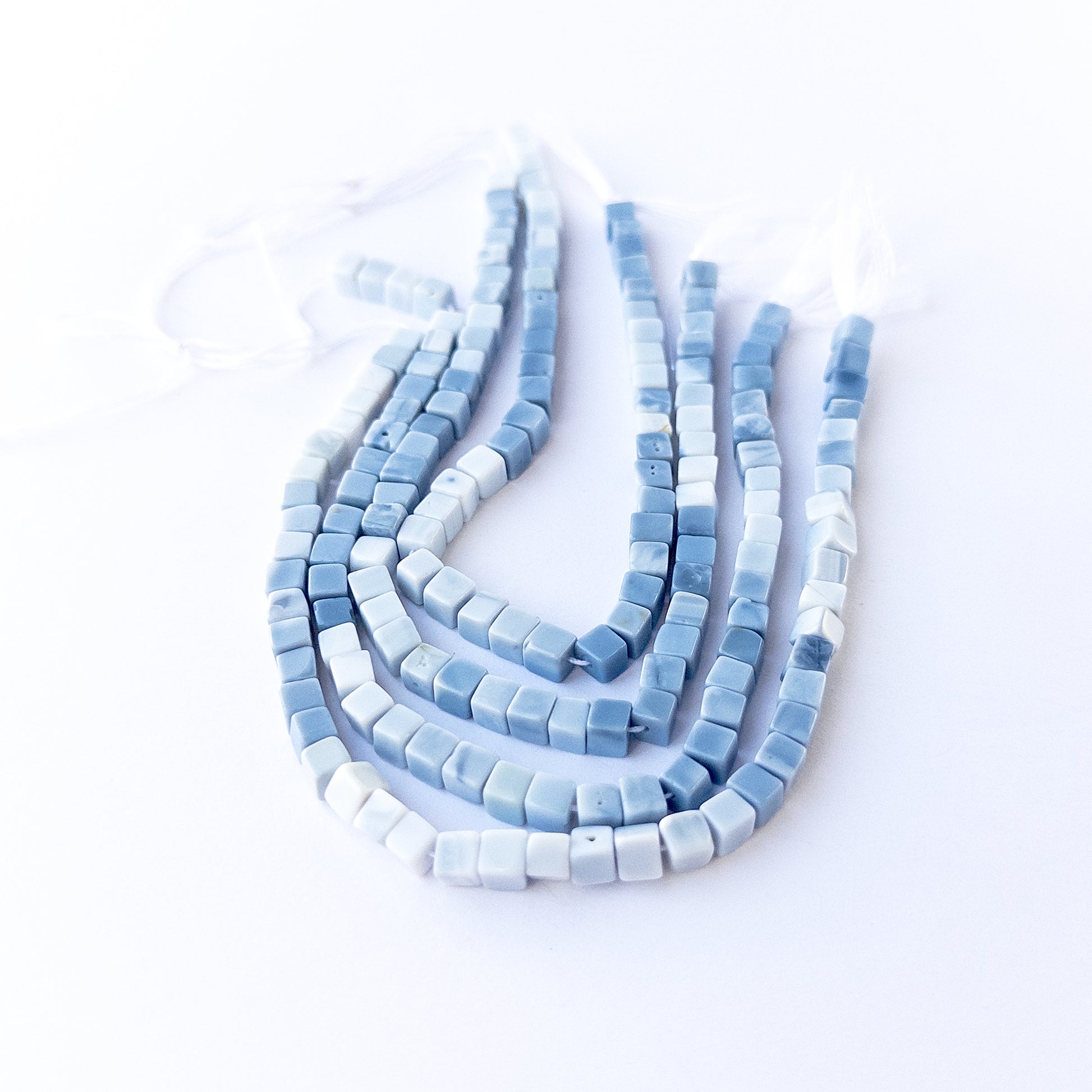 Genuine Denim Opal smooth cube stone beads with polished surfaces ideal for gemstone beads for DIY jewellery making.