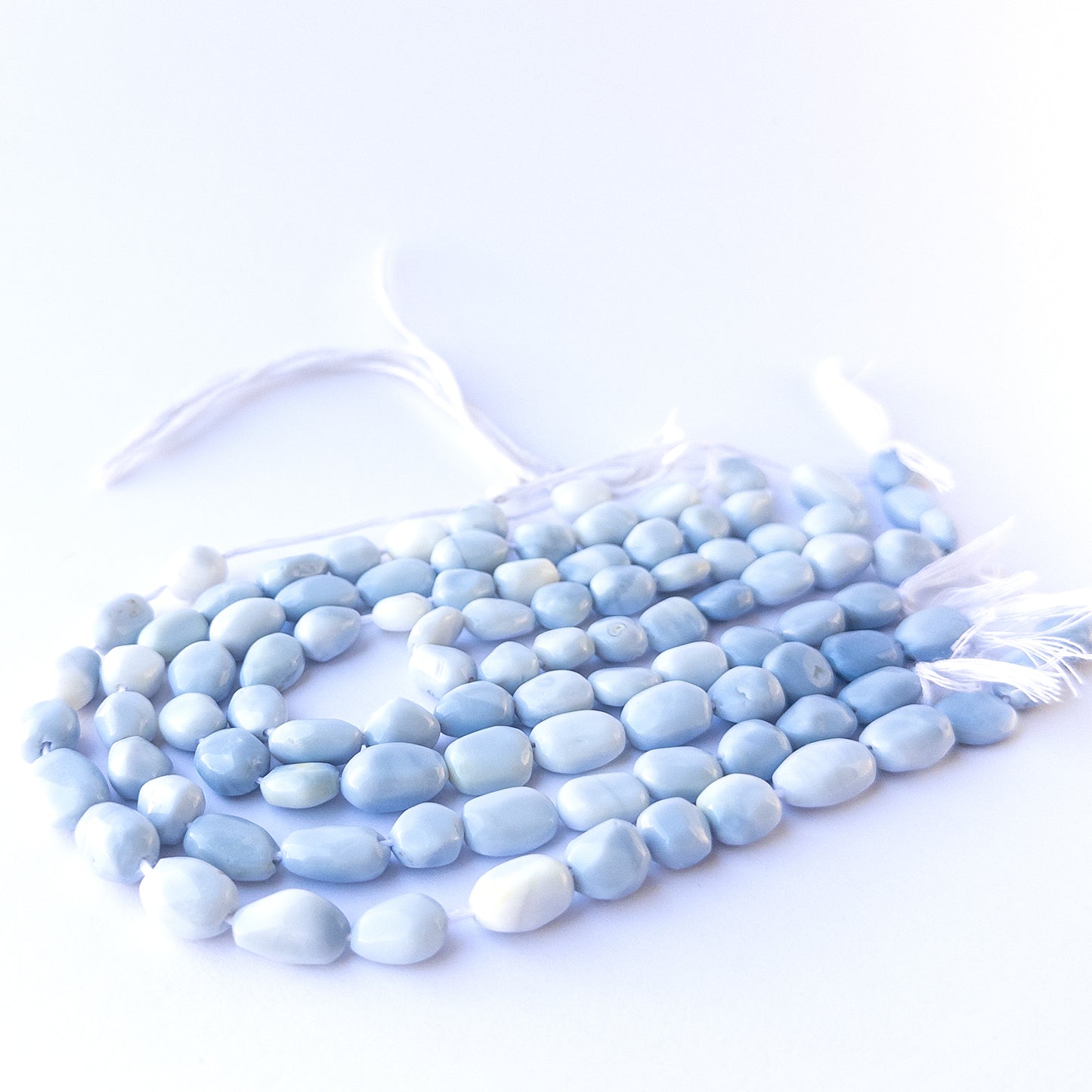 High‑quality denim opal tumble gemstone beads with natural patterns and gentle polished shine.