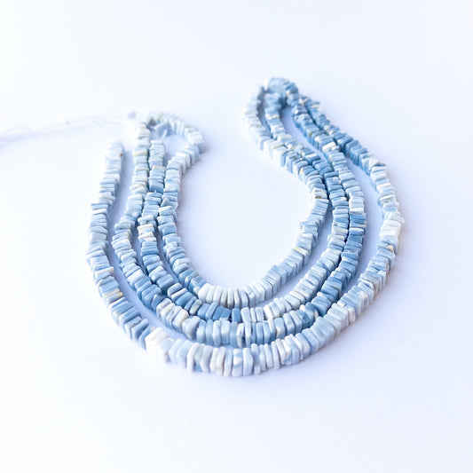 Denim Opal square heishi 4.5mm genuine gemstone beads arranged in a soft blue 41cm strand for handmade jewellery.