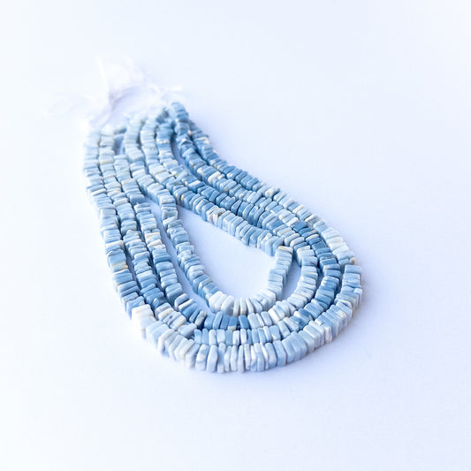 Natural Denim Opal square heishi stone beads 4.5mm displayed neatly for DIY jewellery and authentic gemstone bead designs.