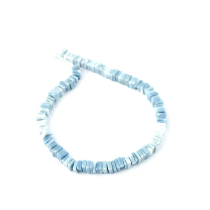 Natural Denim Opal Heishi beads showing soft blue tones and square‑cut texture.
