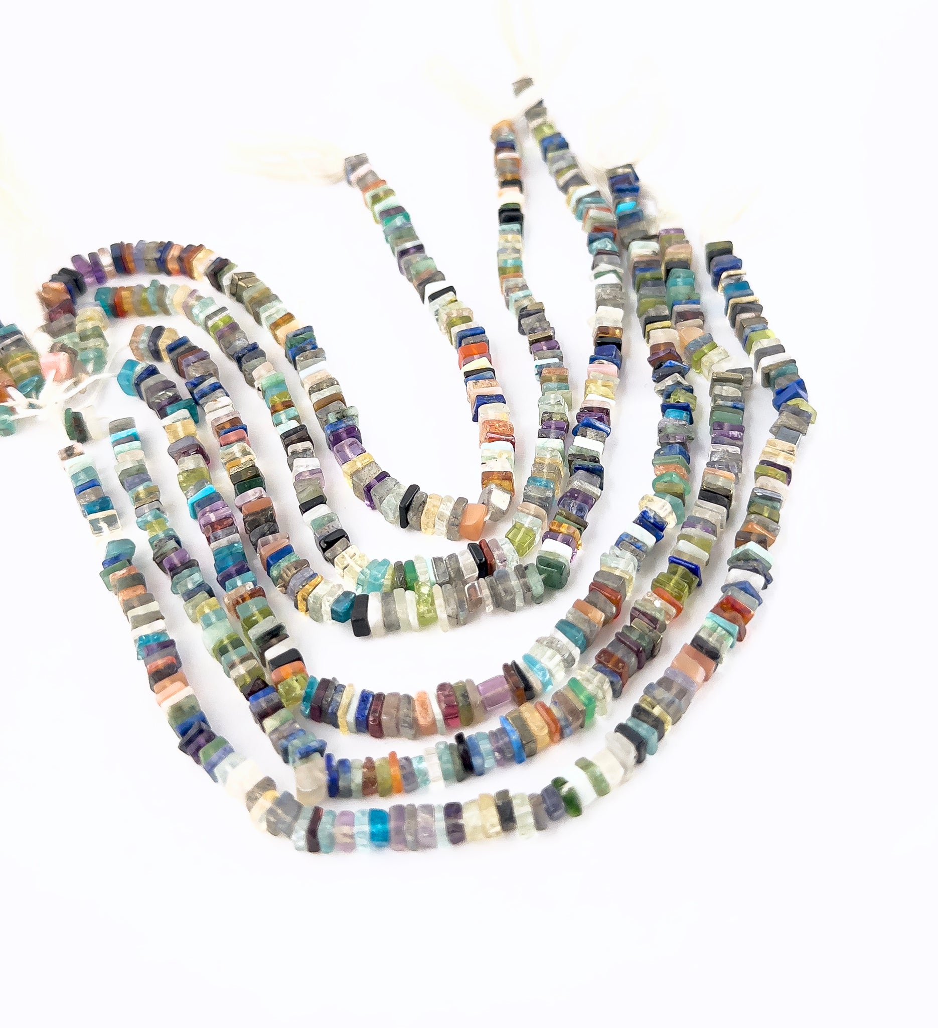 Disco heishi beads featuring smooth edges, uniform thickness, and consistent 4–4.5mm sizing.