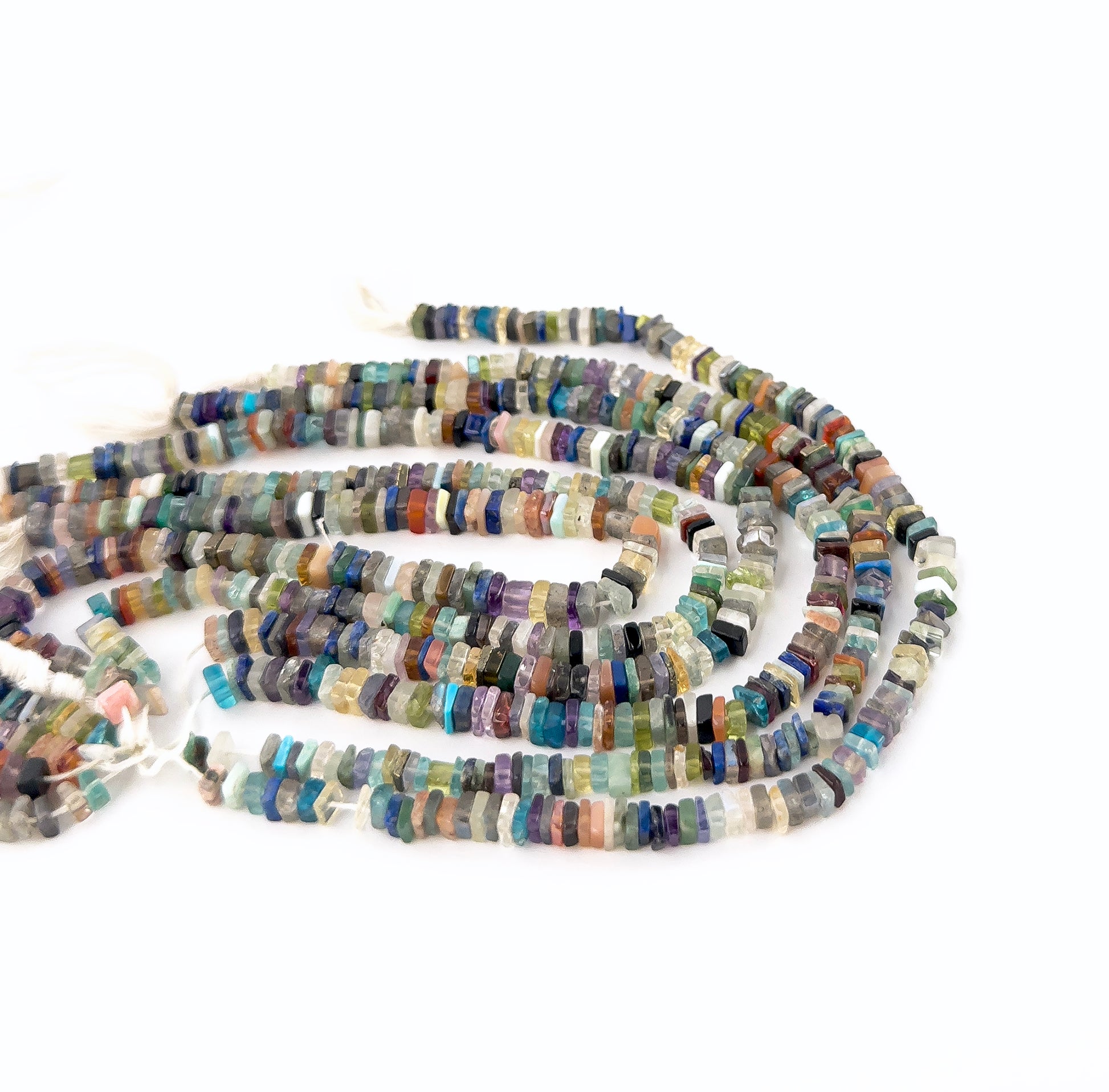 Disco smooth heishi gemstones with even shaping and a polished finish across a compact 20cm strand.