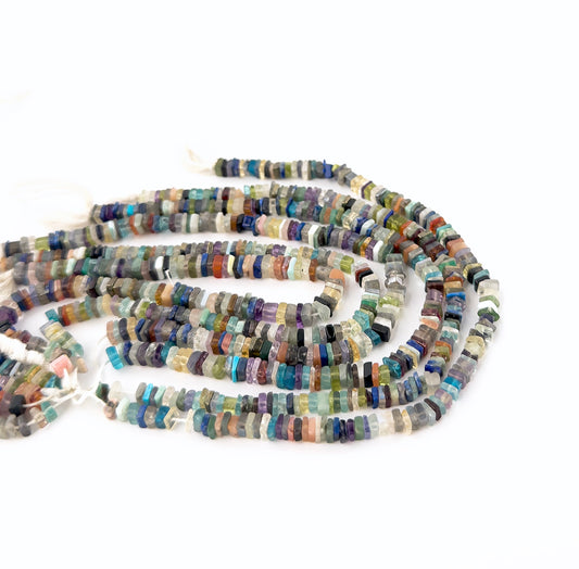 Disco smooth heishi gemstones with even shaping and a polished finish across a compact 20cm strand.