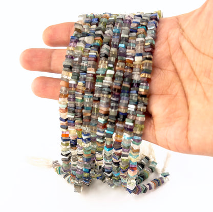 Disco gemstones in smooth heishi form, offering a sleek, modern look with balanced proportions.